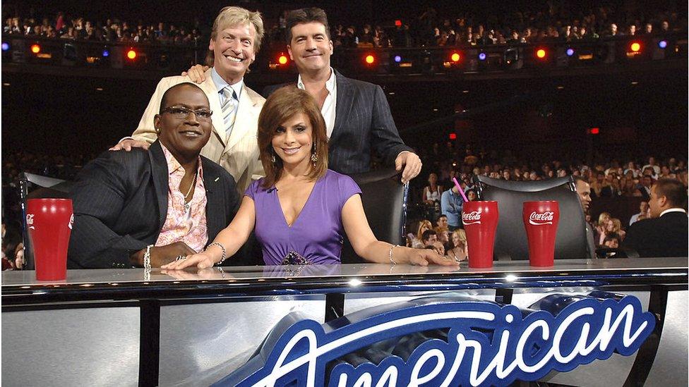 Lythgoe, Cowell, Jackson and Abdul smile for a photo at the American Idol judges desk