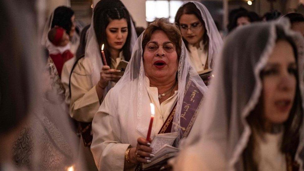 Christians attend an Orthodox Easter service in the Kurdish-controlled city of Qamishli in north-eastern Syria