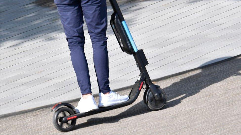 Man on e-scooter