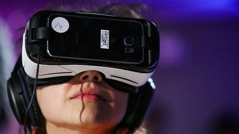 A woman wearing a virtual reality headset