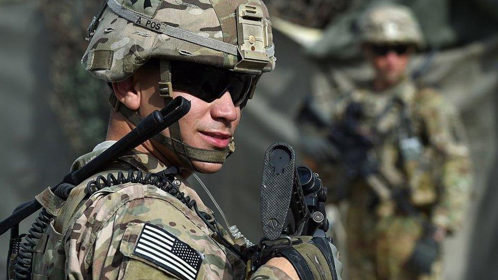 A US soldier stands guard at an Afghan National Army base in the eastern province of Nangarhar