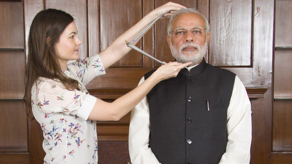 Narendra Modi models for his wax statue