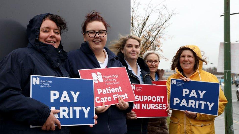 Nurses holding placards on a picket line