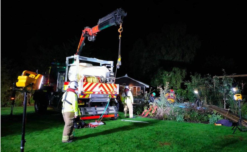 The crane and specialist equipment being used to rescue the horse