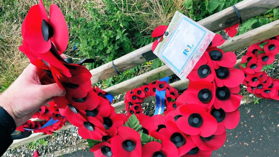 Damaged wreaths at the Narrow Water memorial