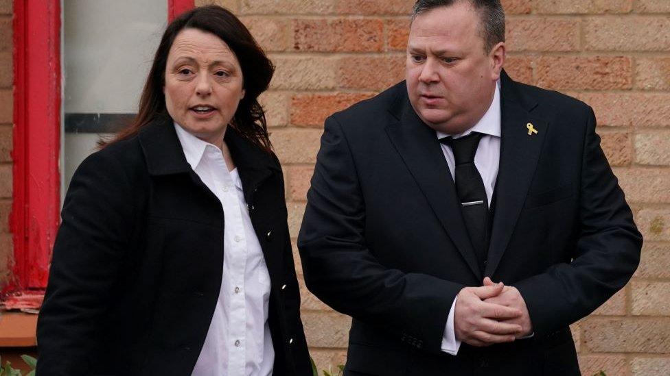 Leah Croucher's parents Claire and John Croucher watch as her funeral cortege prepares to leave