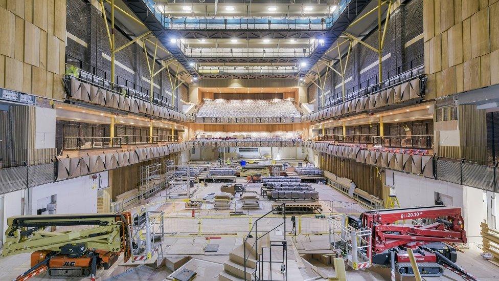 Large theatre space under construction.