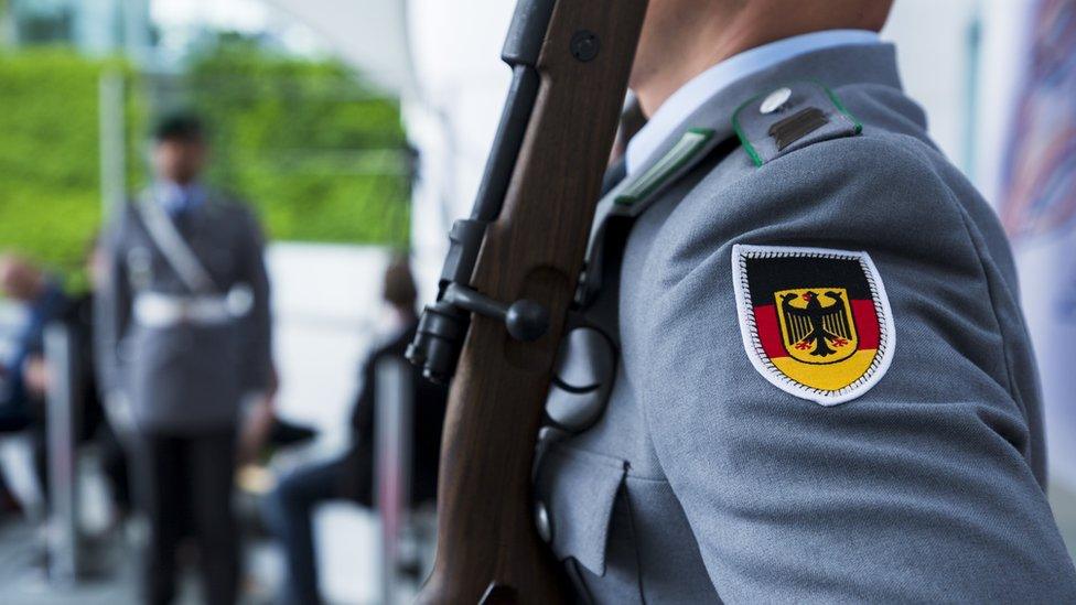 Bundeswehr soldiers stand guard during a meeting at the Chancellery in Berlin