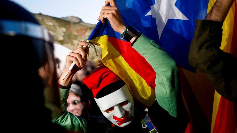 A protester holds an independent Catalonia flag in Barcelona, 30 January