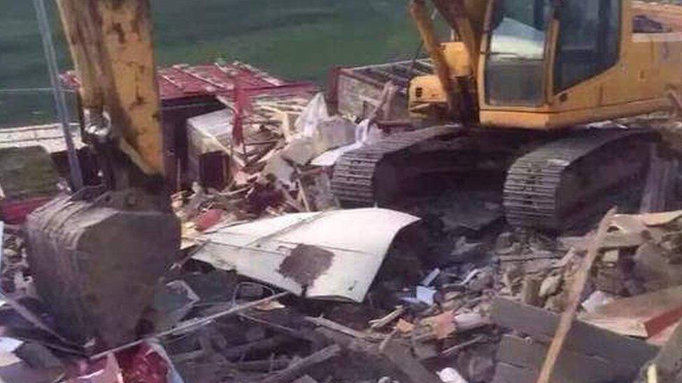 Digger at Larung Gar