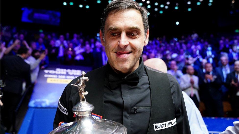 Ronnie O'Sullivan with the World Championship trophy