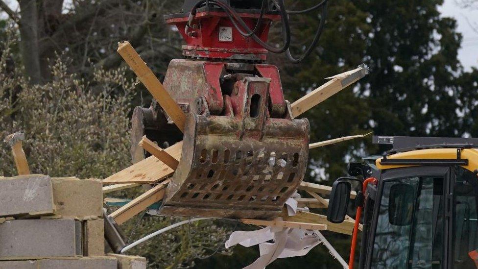 Work continues to demolish an unauthorised spa pool block at the home of Hannah Ingram-Moore, the daughter of the late Captain Sir Tom Moore, at Marston Moretaine, Bedfordshire