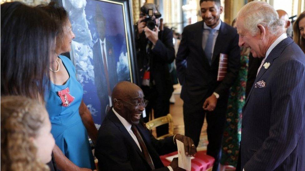 King Charles meeting members of the Windrush generation and their families at Buckingham Palace