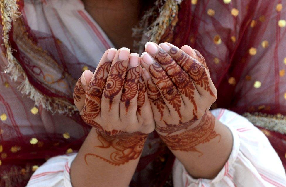 A woman prays