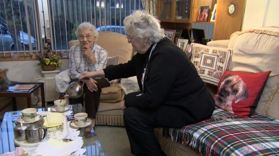 Two friends drinking tea together