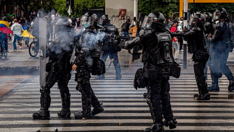 Police officers during a protest in Medellín on 18 May 2021