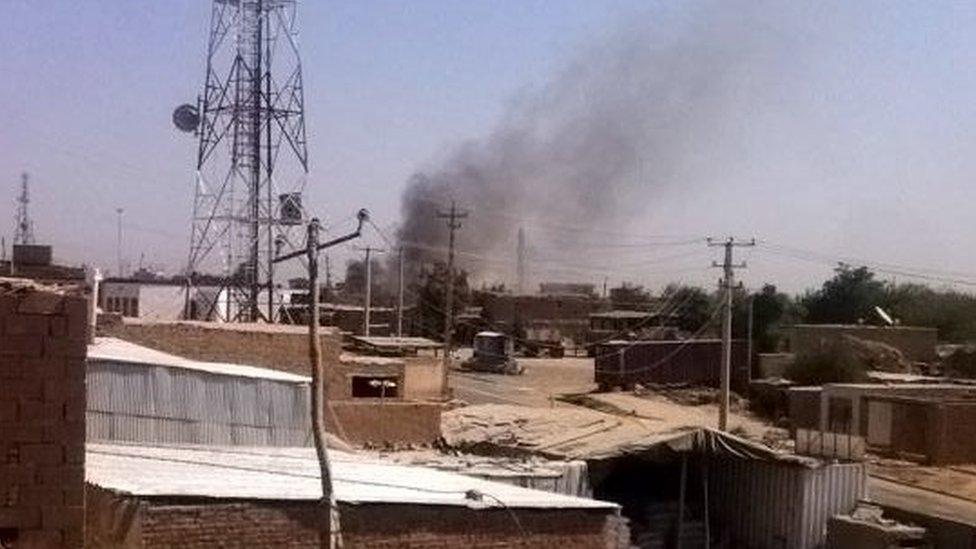 Smoke rises from a police station during clashes between Taliban fighters and Afghan security forces, in Kunduz city 28 September 2015