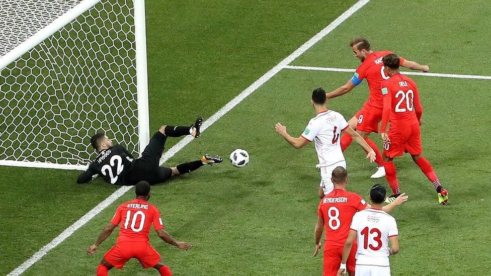 Kane's scores his first goal past the Tunisia goalie.