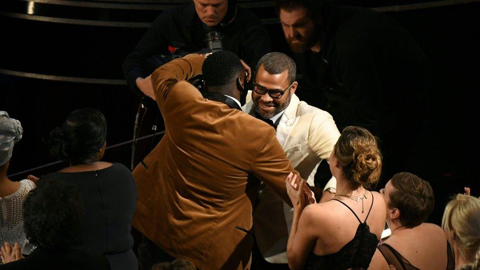 Daniel Kaluuya hugs Jordan Peele