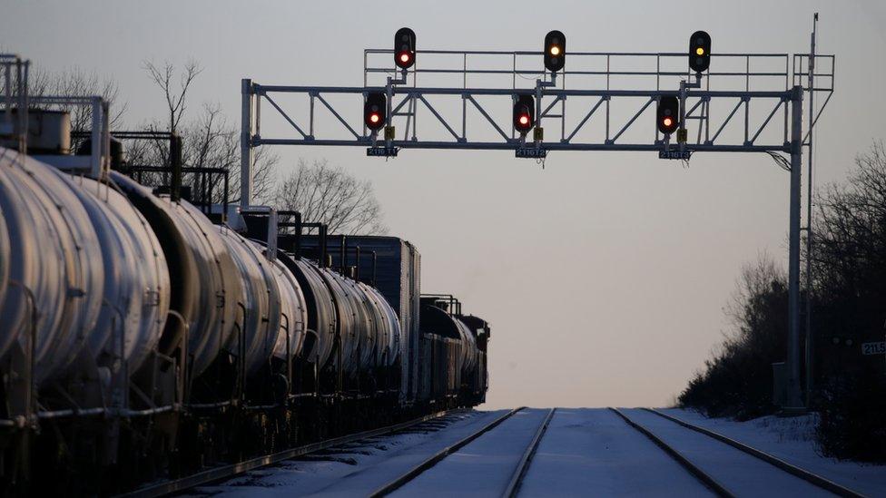 A CN Rail freight train remains halted a few kilometres from a blockade