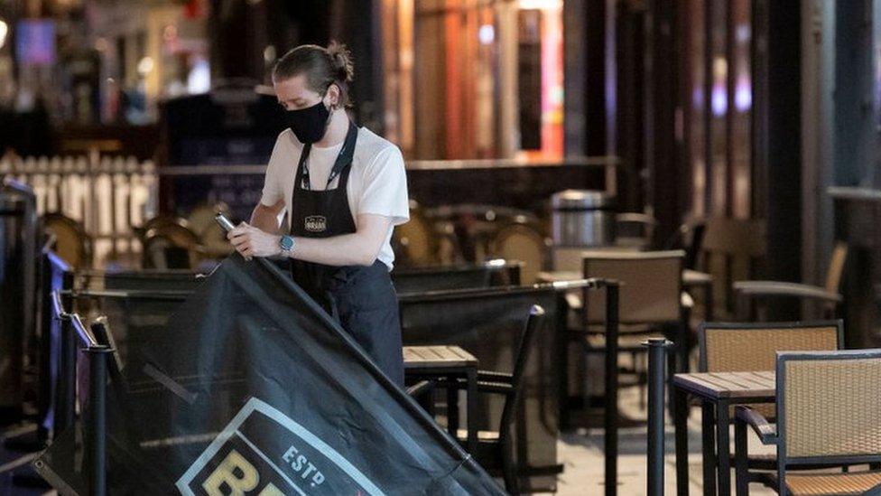 worker in empty pub