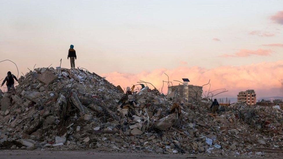 Syrians search rubble for items to salvage after Monday's earthquake