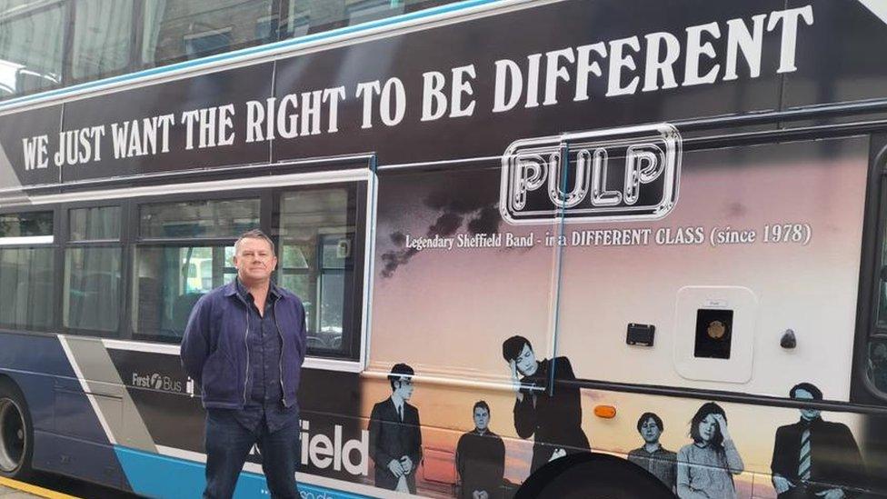 Nick Banks and the new bus which will take fans to the band's gigs