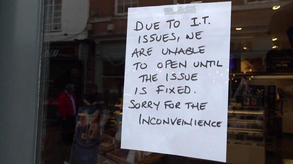 A sign on the door of Greggs in Lichfield