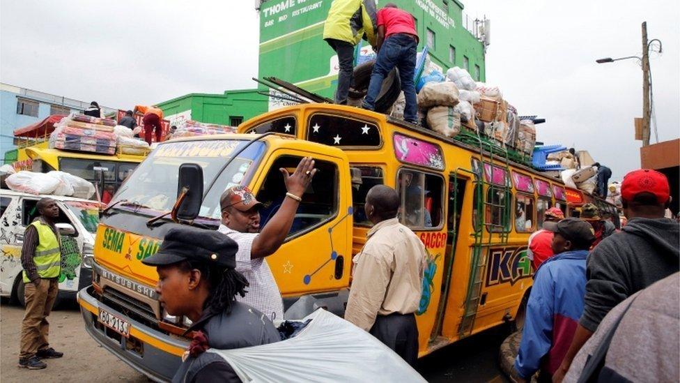 Passengers gather to use public bus transport as they travel to the countryside ahead of next week's general election in Nairobi, Kenya August 3, 2017.