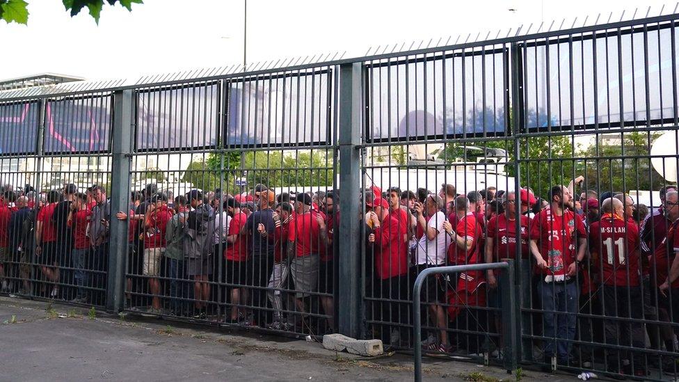 Liverpool fans stuck outside the Stade de France ground as the kick-off is delayed during the Uefa Champions League final in Paris