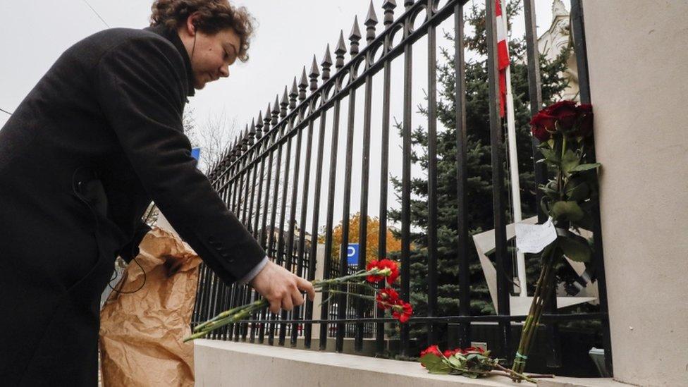 Image shows a wreath near the scene of the attack