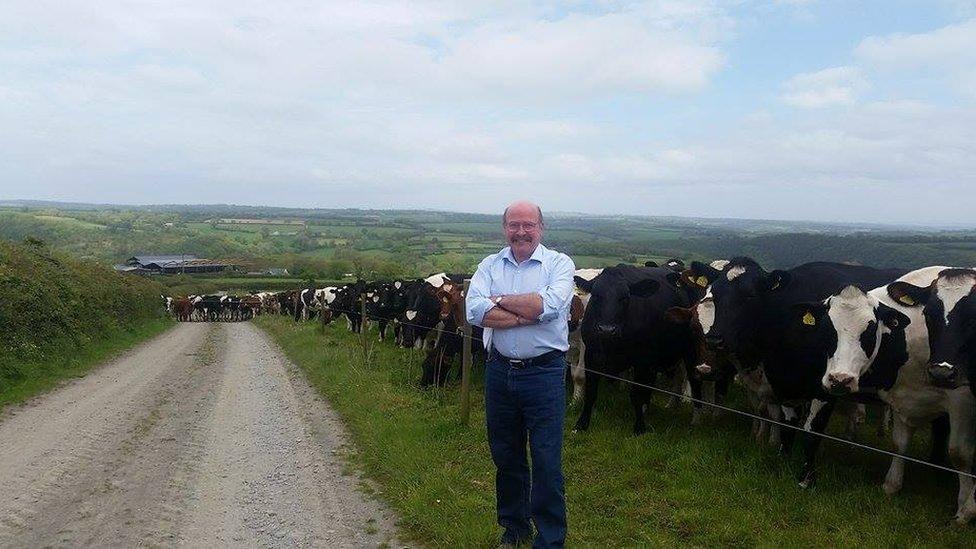 Daioni Organic founder Laurence Harris and cows