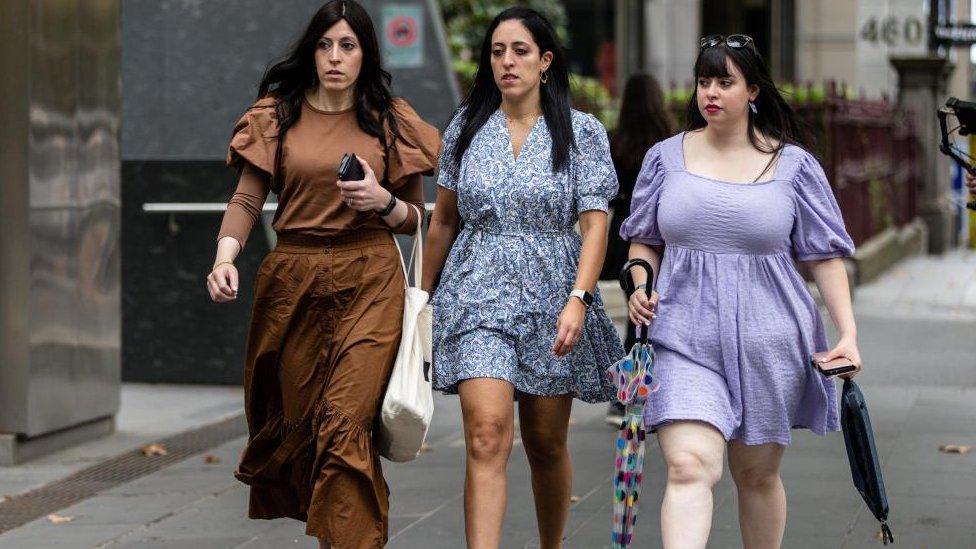 Nicole Meyer, Elly Sapper and Dassi Erlich walking to court in Melbourne