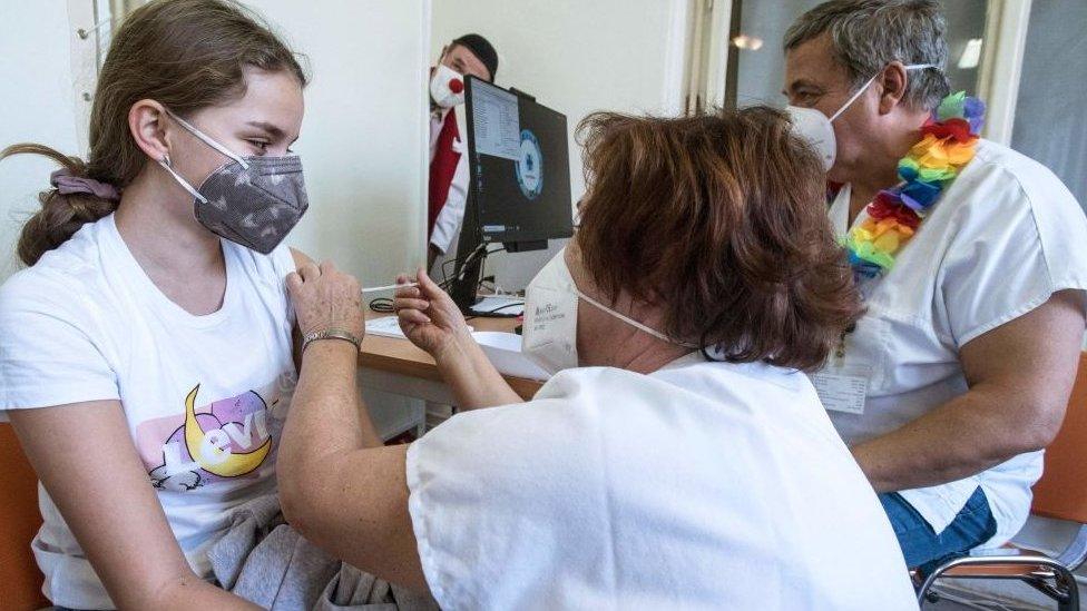 A child receives a Covid vaccine at a Prague hospital