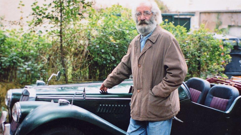 Mohamed Maouche standing by his MG Convertible car