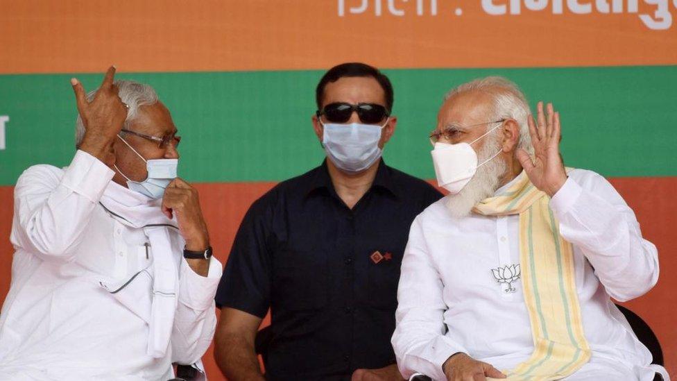 Prime Minister Narendra Modi interacts with Bihar Chief Minister Nitish Kumar during an election campaign rally, on November 1, 2020 in Samastipur, India.