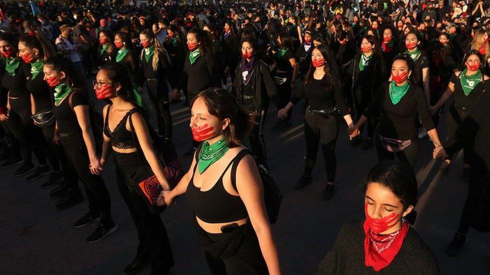 Women take part in a march to mark the International Day for the Elimination of Violence against Women, at Plaza Italia in Santiago, Chile, 25 November 2019.