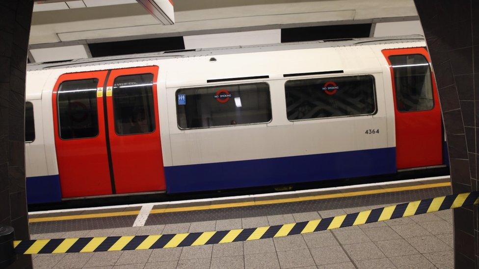 Central Line train behind barrier