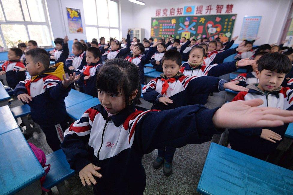 Pupils do exercise in the classroom as heavy smog hits Hebei on 19 December 2016 in Handan, Hebei Province of China. Schools cancel outdoor activities as heavy smog hits Handan.