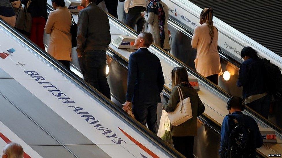 Commuters at a tube station in east London