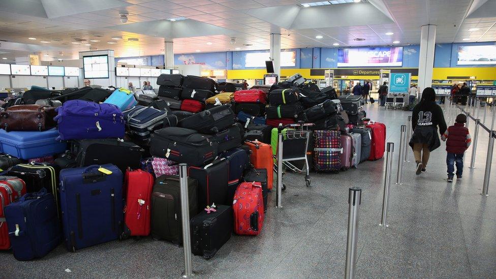 Passengers' hold luggage is stacked in the departure hall of Gatwick airport's North Terminal as severe weather has caused delays and cancellations to numerous flights from the airport on December 24, 2013 in London, England.