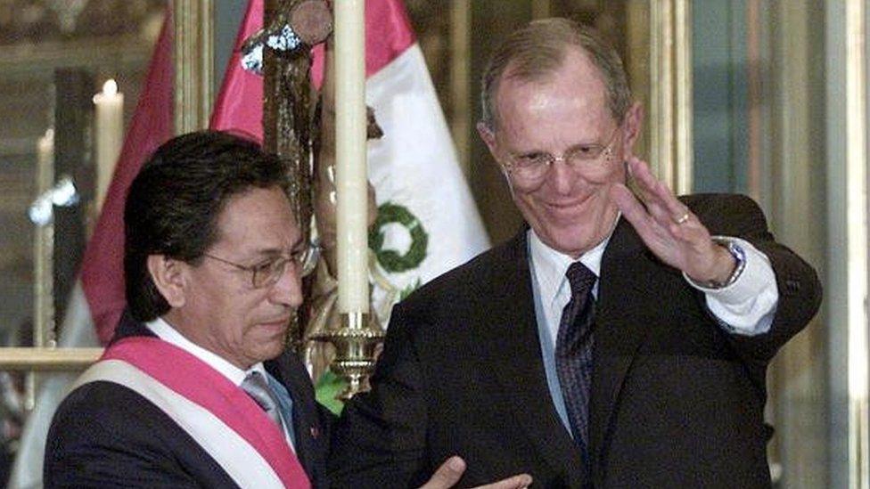 Peruvian President Alejandro Toledo (L) introduces his new Economy Minister Pedro Pablo Kuczynski to the press immediately after the later's inauguration at the government's palace 16 February, 2004 in Lima.