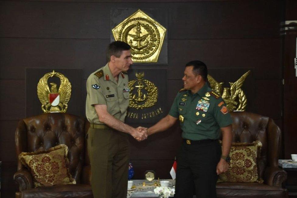 Lieutenant General Angus Campbell shakes hands with General Gatot Nurmantyo in Jakarta