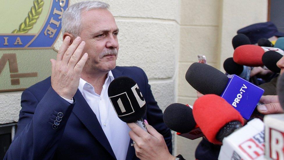 Liviu Dragnea gestures after leaving the Romanian anti-corruption prosecutors headquarters in Bucharest, Romania, November 13, 2017