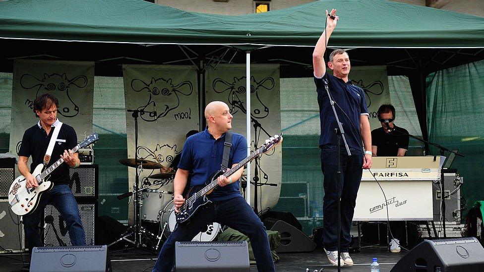 The Inspiral Carpets perform during the NatWest Womens' International T20 between England and West Indies at Old Trafford on September 10, 2012 in Manchester