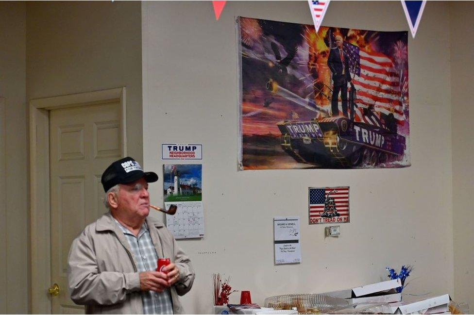 A Trump supporter watches the debate from a campaign field office in Pennsylvania