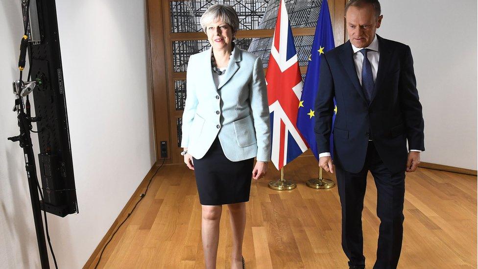 Theresa May (L) and European Council President Donald Tusk