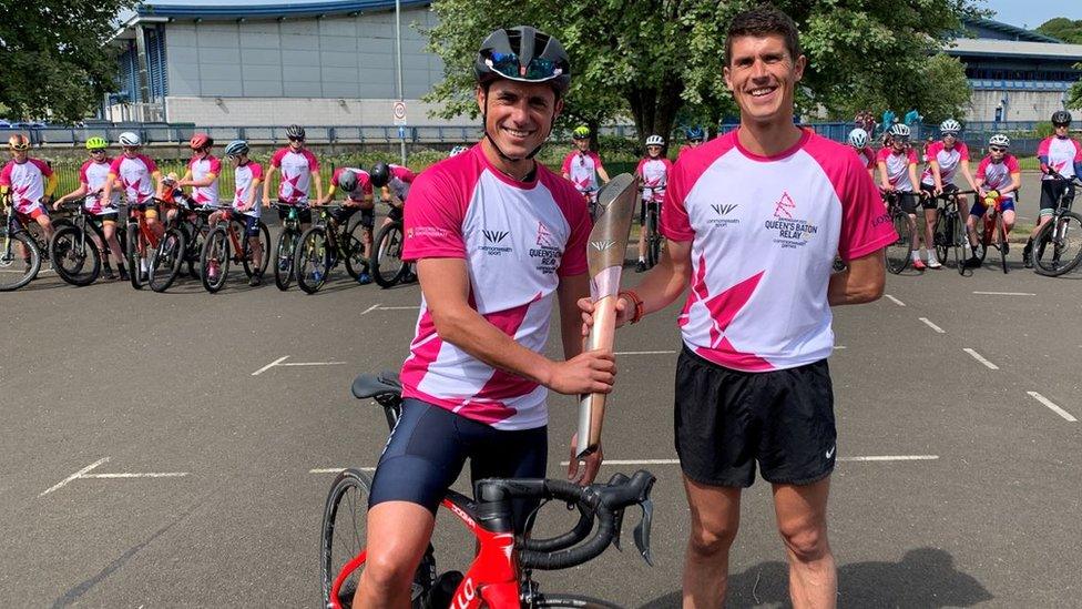 Peter Kennaugh and Christian Varley holding the baton