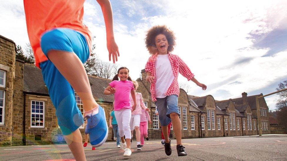 kids outside in playground on a sunny day