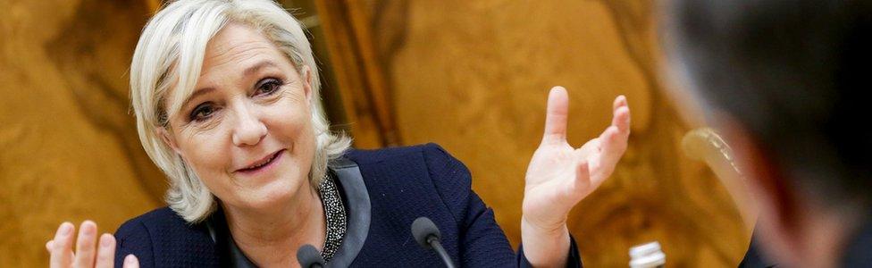 French far-right presidential candidate Marine Le Pen, left, gestures as she speaks to Vyacheslav Volodin, back to a camera, during their meeting in the Lower House of the Russian Parliament in Moscow